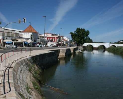 The River Arade glides through Silves town center